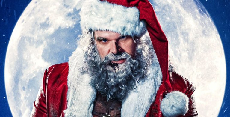 David Harbour celebrates the holidays with Violent Night 2 script in hand